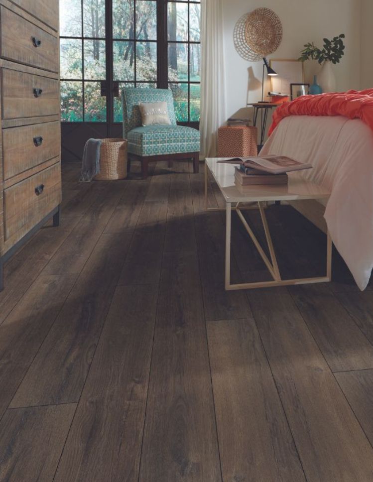 LVP floors in a rustic bedroom